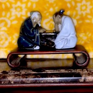 Set of 3 Chinese mud men figurines with wood scroll stands.